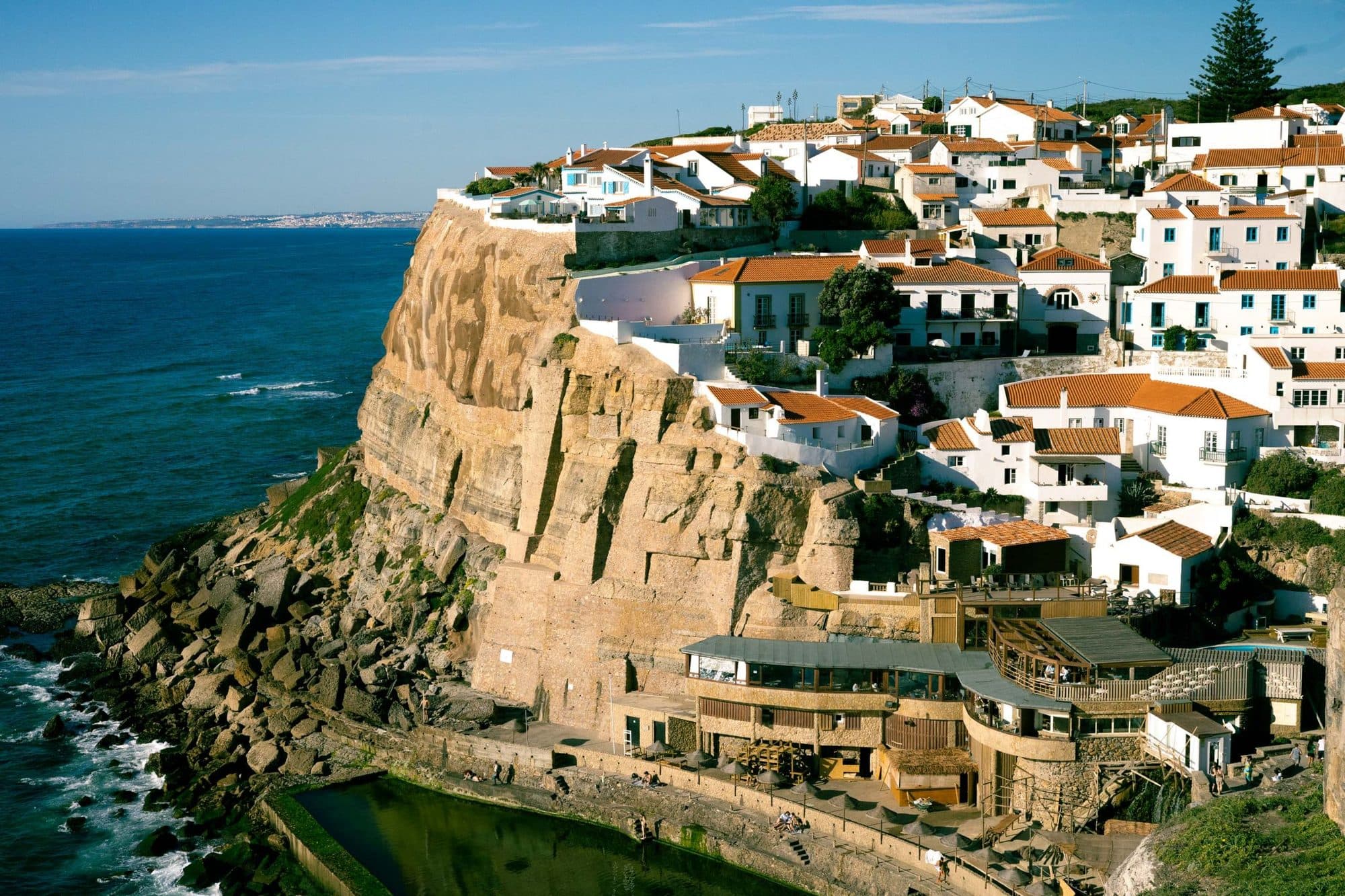 A white clifftop town above the Atlantic in Portugal